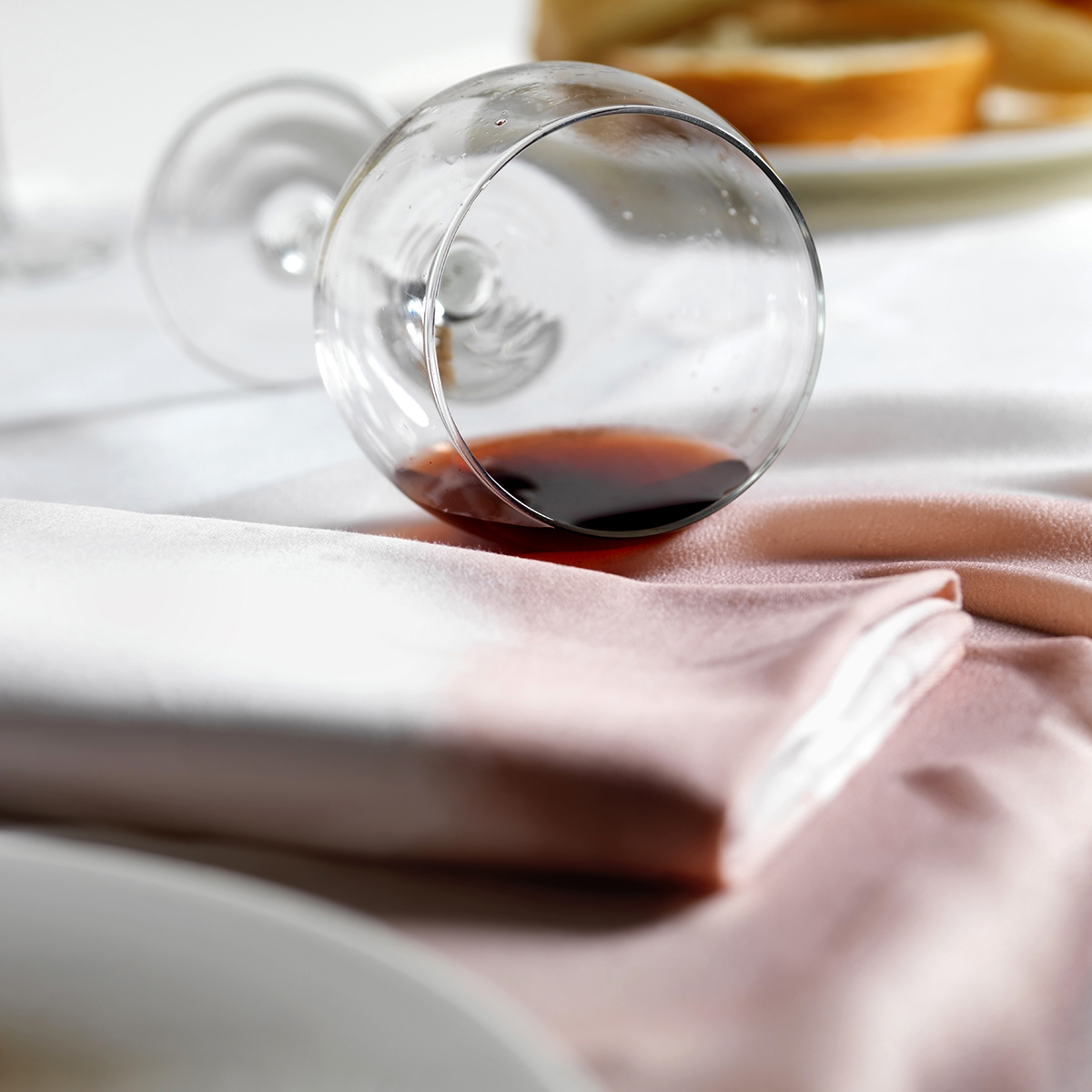 Red wine spill stain on linens
