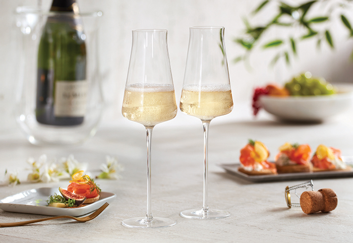 Two wine enthusiast zenology somm champagne flutes